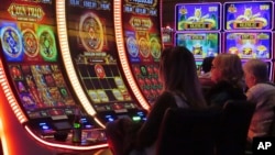 FILE - Gamblers play slot machines at the Ocean Casino Resort in Atlantic City, N.J., on Nov. 29, 2023. Figures released on Feb. 20, 2024, by the American Gaming Association show that the U.S. commercial casino industry had its best year ever in 2023.