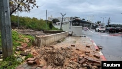 A view of the site where a rocket landed after it was fired from Lebanon, amid the conflict between Israel and the Palestinian Islamist group Hamas, near the entrance to a hospital in Safed, northern Israel, Feb. 14, 2024.