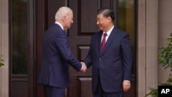 FILE - President Joe Biden greets China's President President Xi Jinping at the Filoli Estate in Woodside, California, Nov, 15, 2023, on the sidelines of the Asia-Pacific Economic Cooperative conference.