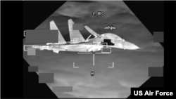 A People’s Republic of China J-11 aircraft is shown in this screen grab from U.S. Air Force B-52 on Oct. 24, 2023.