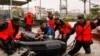 Paramilitary police officers evacuate residents stranded by floodwaters in Xincuo town of Fuqing city, after Typhoon Doksuri made landfall and brought heavy rainfall in Fuzhou, Fujian province, China, July 29, 2023. 