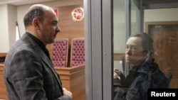 FILE - Radio Free Europe/Radio Liberty (RFE/RL) journalist Alsu Kurmasheva, accused of violating Russia's law on foreign agents, talks to her lawyer during a court hearing in Kazan, Russia, Oct. 23, 2023. 
