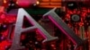 FILE - The letters AI (for artificial intelligence) and a robot's hand are seen against the backdrop of an illuminated computer motherboard in this illustration photo taken June 23, 2023.