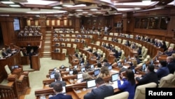 Dorin Recean, Moldovan president's nominee for prime minister, makes an address during a session of parliament in Chisinau, Feb. 16, 2023. 