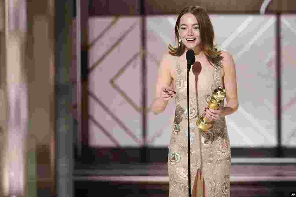 This image released by CBS shows Emma Stone accepting the award for best female actor in a motion picture for her role in "Poor Things" during the 81st Annual Golden Globe Awards in Beverly Hills, Calif., on Jan. 7, 2024. 