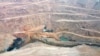 In this aerial photo released by China's Xinhua News Agency, rescuers work at the site of a collapsed open pit coal mine in Alxa League in northern China's Inner Mongolia Autonomous Region, Feb. 23, 2023.