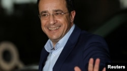 Newly elected President of Cyprus Nikos Christodoulides arrives for a meeting with Cyprus' President Nicos Anastasiades at the Presidential Palace in Nicosia, Feb. 13, 2023.