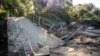 A general view of a damaged bridge after a small creek bursts its bank causing houses to flood in Havelock North, New Zealand, Feb. 18, 2023. 