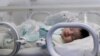 A baby girl born during a deadly earthquake earlier this month lies in the Jihan Hospital in Afrin, Syria, Feb. 18, 2023. 