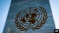 FILE - The symbol of the United Nations is displayed outside the Secretariat Building, Feb. 28, 2022, at United Nations Headquarters. 