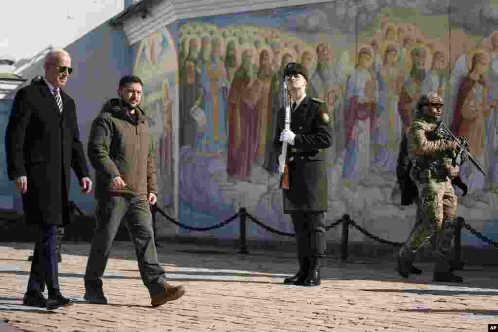 President Joe Biden walks with Ukrainian President Volodymyr Zelenskyy at St. Michael's Golden-Domed Cathedral on a surprise visit, Feb. 20, 2023, in Kyiv.
