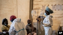 FILE - Health workers treat cholera patients at the Bwaila Hospital in Lilongwe, central Malawi, Jan. 11, 2023.