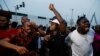 People cheer after poll workers announced results at their polling unit in Awka, Anambra state, Nigeria, Feb. 25, 2023. By evening, some polling stations were already counting ballots while voting was still going on at others and had not taken place elsewhere. 