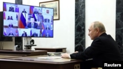 Russian President Vladimir Putin chairs a meeting to discuss the aftermath and measures taken after the attack on the Crocus City Hall concert venue, at a residence outside Moscow, March 25, 2024. (Sputnik/Mikhail Metzel/Pool via Reuters)