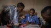 Residents register their data at a registration centre on the first day of operation in Goma, eastern Democratic Republic of Congo, Feb. 16, 2023.