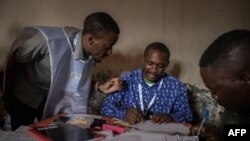 Residents register their data at a registration centre on the first day of operation in Goma, eastern Democratic Republic of Congo, Feb. 16, 2023.