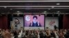 FILE - Supporters of the Iranian-backed Hezbollah group listen to a speech by Hezbollah leader Sayyed Hassan Nasrallah speaking via a video link, in the southern suburbs of Beirut, May 14, 2024.