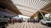 A handout photograph released by French Ministry for Europe and Foreign Affairs shows passengers queueing outside Diori Hamani international airport in Niamey, Niger, on Aug. 2, 2023.