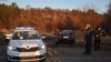 Police work in Bulgaria, near where, according to the Bulgarian Interior Ministry, at least 18 people were found dead in an abandoned truck on Feb. 17, 2023. 
