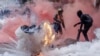 FILE - A tear gas canister explodes in downtown Nairobi as protesters try to help injured people outside the Kenya Parliament during a strike to protest tax hikes and the 2024 finance bill. After the protests, Kenya experienced a nationwide loss in internet connectivity. 