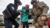 Ukraine, Russia trade blame for targeting civilians in residential areas 