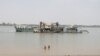 FILE - A ferry is shown on March 18, 2024, along the Mekong River where a proposed canal is planned.