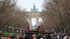 The remains of a destroyed Russian T-72 tank, secured from the Ukrainian village of Dmytrivka, outside Kyiv are on display near the the Brandenburg Gate during an event to mark the one-year anniversary of the Russian invasion of Ukraine, in Berlin, Germany, Feb. 24, 2023. 