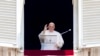 FILE - Pope Francis delivers his blessing as he recites the Angelus noon prayer from the window of his studio overlooking St. Peter's Square, at the Vatican, June 18, 2023. 
