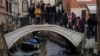 Boats are pictured in a canal during a severe low tide in the lagoon city of Venice, Italy, Feb. 17, 2023. 
