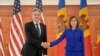 U.S. Secretary of State Antony Blinken. left, shakes hands with Moldova's President Maia Sandu, right, at the Presidential Palace in Chisinau, Moldova, May 29, 2024. 