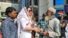 FILE - In this photograph taken on Jan. 4, 2024, transgender candidate Anwara Islam Rani shakes hands with a man during a campaign event in Rangpur, ahead of Bangladesh's general election on Jan. 7. Although unsuccessful, her campaign garnered significant public support.
