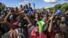 Supporters of Niger's National Council of Safeguard of the Homeland (CNSP), are seen outside a Nigerien airbase housing French troops in Niamey, Sept. 3, 2023, demanding their departure from Niger.