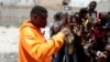 Jimmy Cherizier, the leader of the G9 et Famille gang, speaks to journalists in Delmas 6, a district of Port-au-Prince, Haiti, Aug. 16, 2023. 