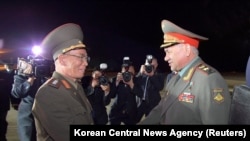 
In this photo released by North Korea's Korean Central News Agency, Russian Defense Minister Sergei Shoigu, right, is welcomed by North Korean Defense Minister Kang Sun Nam at Pyongyang International Airport in Pyongyang, North Korea, July 25, 2023.