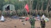 FILE - Members of the Myanmar National Democratic Alliance Army are pictured with weapons allegedly seized from the Myanmar's army outpost on a hill in Chinshwehaw town, Myanmar, Oct. 28, 2023.