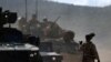 Kendaraan lapis baja bergerak selama latihan militer "Noble Blueprint 2023" di pangkalan militer Novo Selo, Bulgaria, 26 September 2023. Latihan ini diselenggarakan oleh Brigade Multinasional NATO di bawah komando Italia. (Foto: Ilustrasi/Reuters)