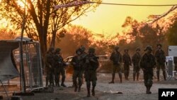 Israeli soldiers patrol Oct. 12, 2023, near Kibbutz Beeri, where 270 revelers were killed by Hamas militants during the Supernova music festival on Oct. 7.