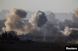 Smoke rises after Israeli air strikes in north Gaza, as seen from southern Israel, amid the ongoing conflict between Israel and the Palestinian group Hamas, Nov. 23, 2023.