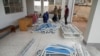 Ugandan Medical staff members assemble beds to be used in the Ebola treatment Isolation Unit at Mubende regional referral hospital in Uganda on Sept. 24, 2022.