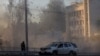 FILE - A view shows flying debris from an explosion in a street during a Russian drone strike, which local authorities consider to be Iranian-made Shahed-136 unmanned aerial vehicles (UAVs), in Kyiv, Ukraine, Oct. 17, 2022. 