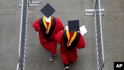 FILE - New graduates enter High Point Solutions Stadium prior to Rutgers University's graduation ceremony, in Piscataway Township, N.J., May 13, 2018. A U.S. Supreme Court associate justice has again declined to block President Joe Biden's plan to cancel billions in student debt.