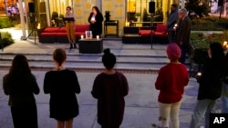 Students gather at a candlelight vigil in support of Ukraine, outside the University of Southern California's Office of Religious & Spiritual Life, in Los Angeles, March 1, 2022.