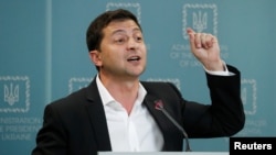 Ukrainian President Volodymyr Zelenskiy speaks during a news conference in Kyiv, Oct. 1, 2019.