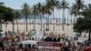 Fans of the late Brazilian football star Pele gather on the street as a firetruck transports Pele's coffin to the Santos' Memorial Cemetery in Santos, Sao Paulo state, Brazil on January 3, 2023.