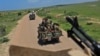 ARCHIVES - Des soldats somaliens en patrouille près de la base militaire de Sanguuni, à environ 450 km au sud de Mogadiscio, le 13 juin 2018.