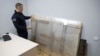 FILE - The recovered work of street artist Banksy, which a group of people tried to steal from a wall of a residential building in the town of Hostomel, is held at a police office in the town of Boiarka, Kyiv region, Ukraine, Dec. 3, 2022. 