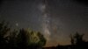 FILE - The Milky Way is seen during the Perseids meteor shower in Berducedo, Spain, Aug. 12, 2018.