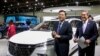 FILE - Chinese Ambassador to the US Qin Gang (left) at the North American International Auto Show in Detroit, Michigan, Sept. 14, 2022.