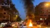 FILE - A police motorcycle burns during a protest over the death of Mahsa Amini, a woman who died after being arrested by the Islamic republic's 'morality police' in Tehran, Iran, Sept. 19, 2022.