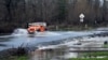 A vehicle drives on a flooded road in Sebastopol, California, Jan. 5, 2023. 
